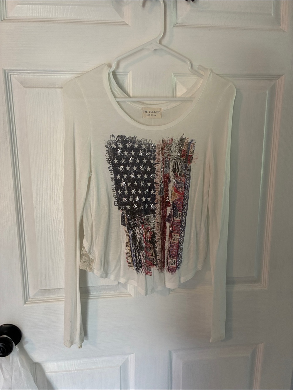 The Classic White Long-Sleeve Tee with Distressed Flag Graphic